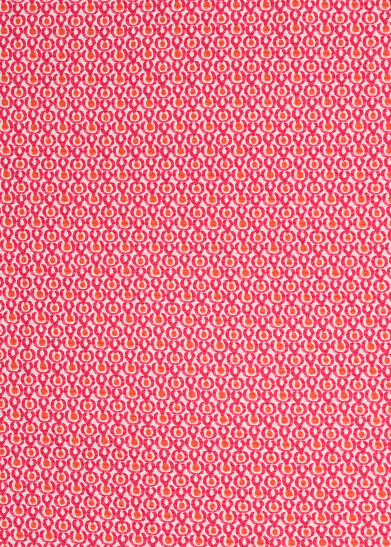 A close up of Cabana Life's Amelia Island pink and coral dot print with a on a UPF 50+ pique fabric.