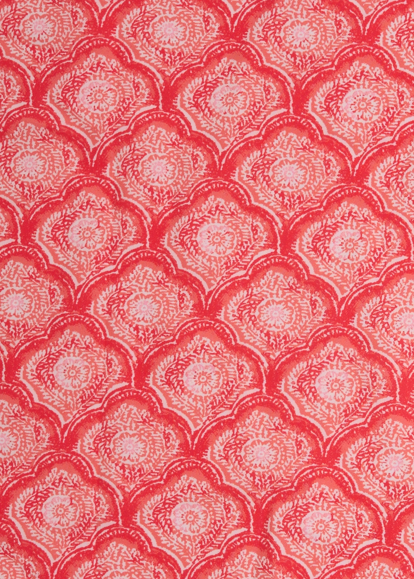 A close up of Cabana Life's Amelia Island pink and coral colored tile print on a UPF 50+ fabric.