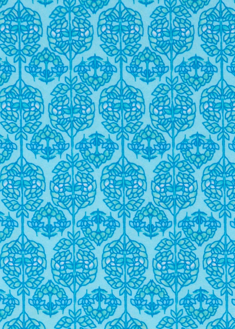 A close up of the UPF 50+ blue printed woven fabric on the Cabana Life Rosebay Relaxed Maxi Dress.