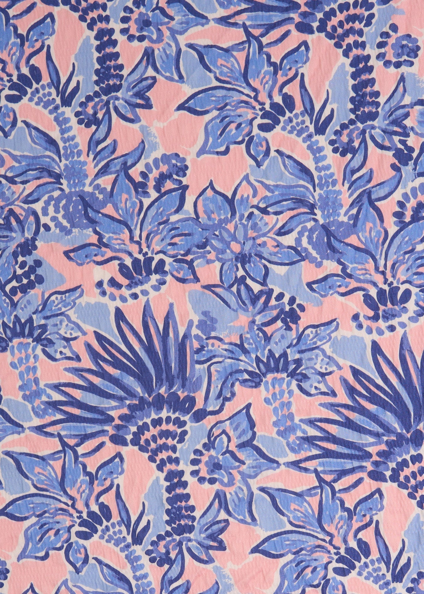 A close up of the UPF 50+ palm print textured fabric on the Cabana Life Palm Beach Flutter Sleeve Maxi Dress.