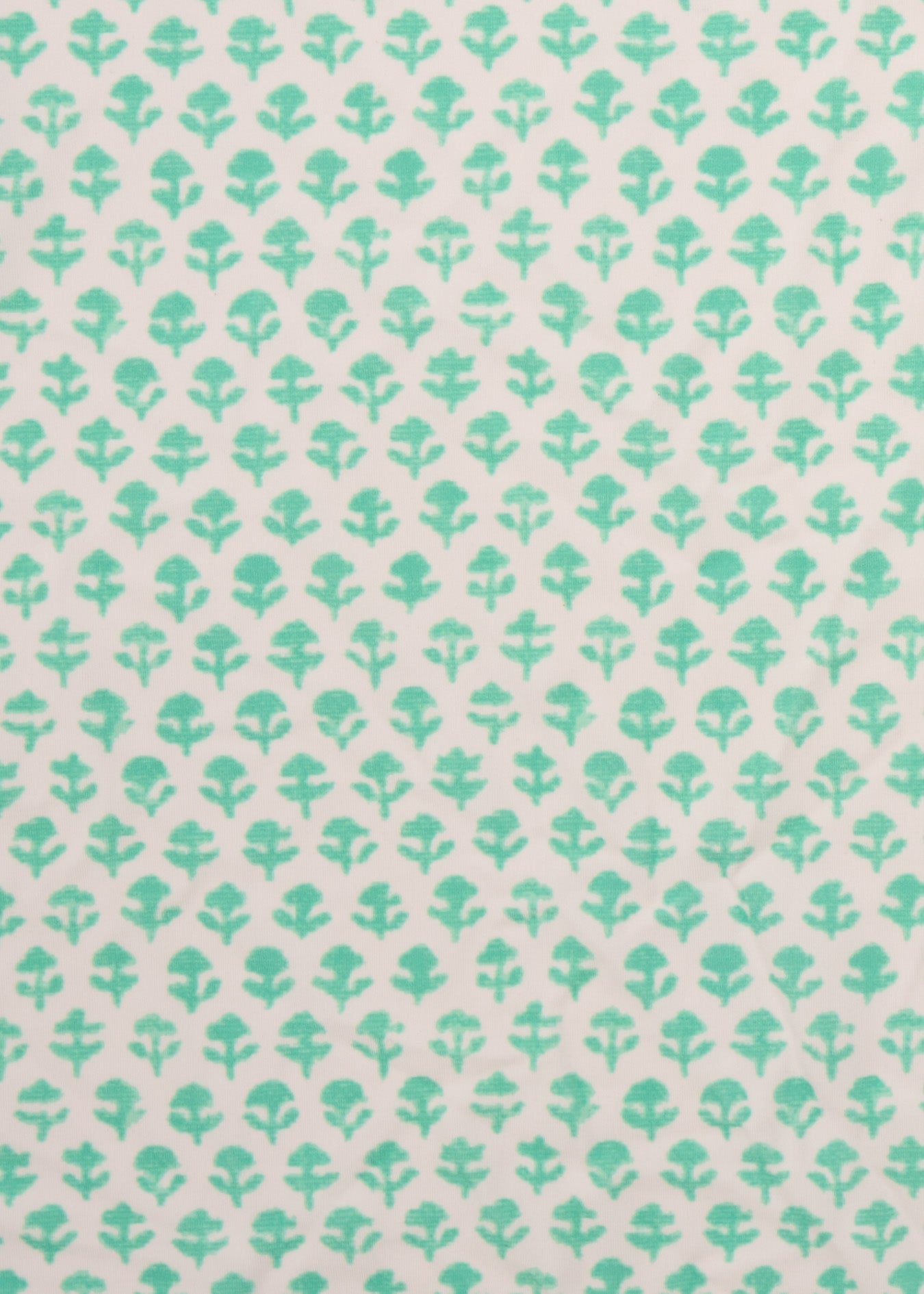 A close up of the UPF 50+ mint flower printed fabric on the Cabana Life Rosebay Smocked Waist Dress.