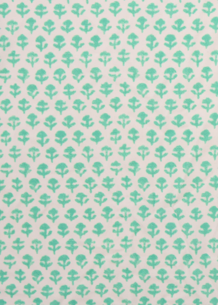 A close up of the UPF 50+ mint flower printed fabric on the Cabana Life Rosebay Smocked Waist Dress.