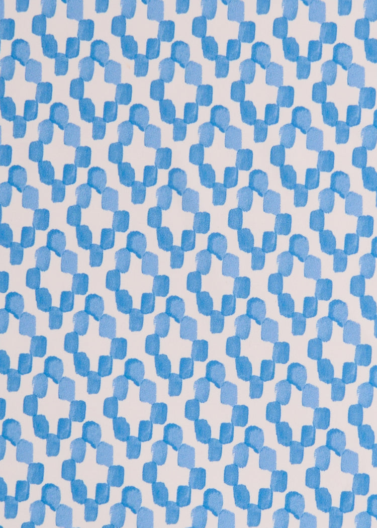 A close up of Cabana Life's Seaside watercolor white and light blue diamond print on a UPF 50+ fabric.