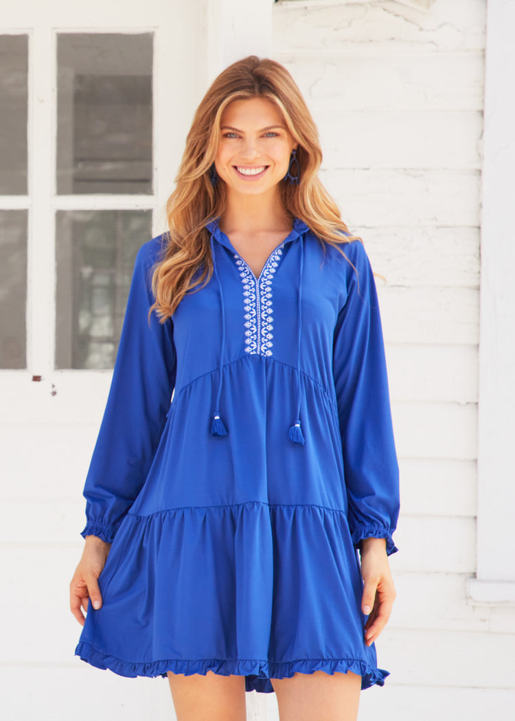 Blonde woman with wavy hair wearing Navy Embroidered Tiered Dress.