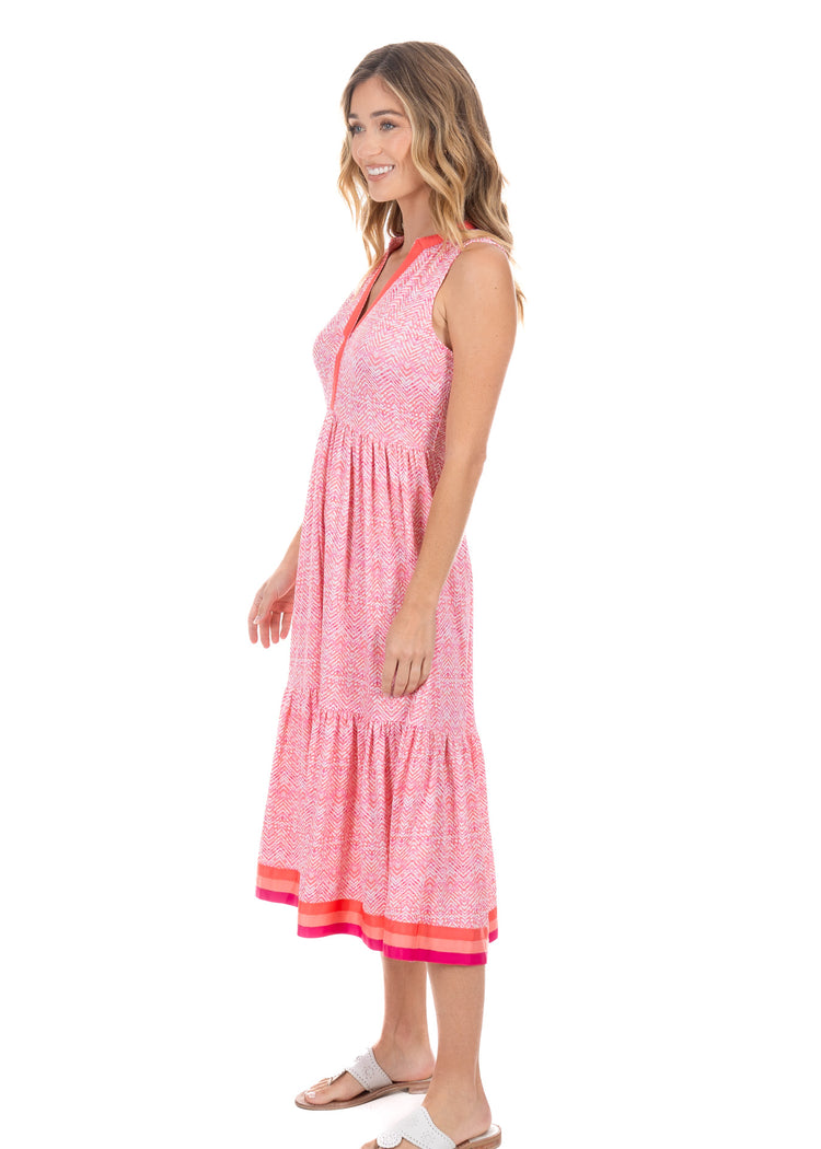 Blonde woman wearing the Algarve Midi Dress, showing the side of the dress.