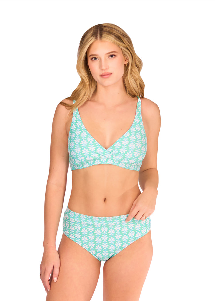 Woman in green side of Cote d`Azur Reversible Wrap Bikini Top and Cote d`Azur Reversible High Waisted Bikini Bottom