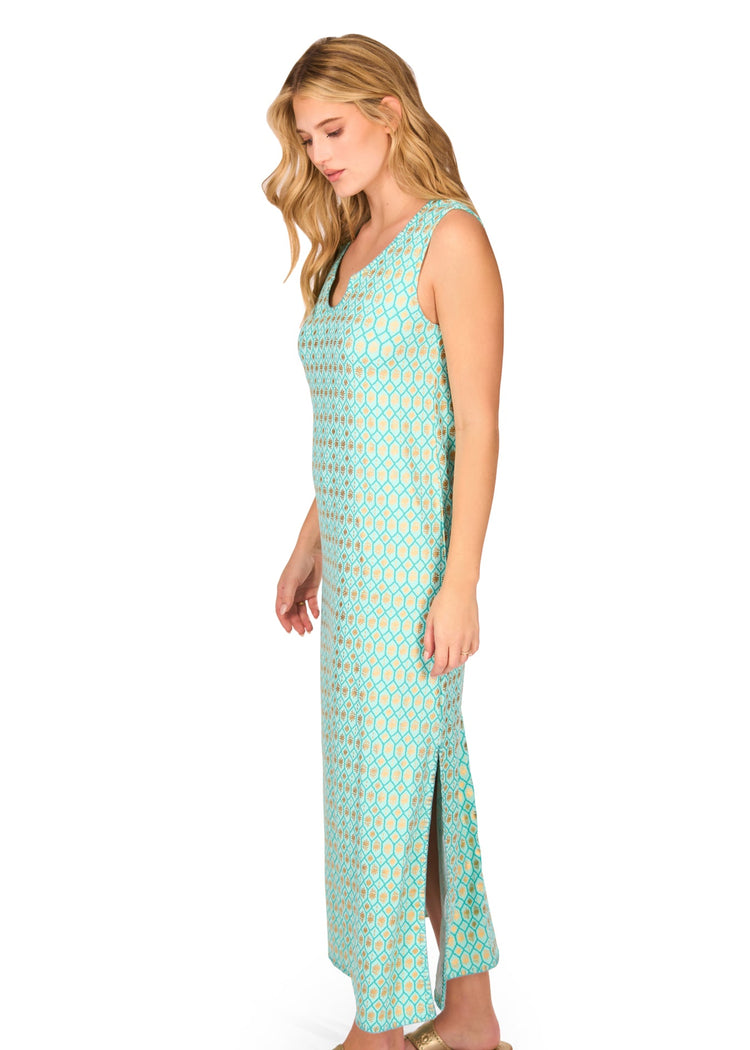 The side of a blonde woman wearing the Aqua Metallic Side Slit Maxi Dress on a white background.
