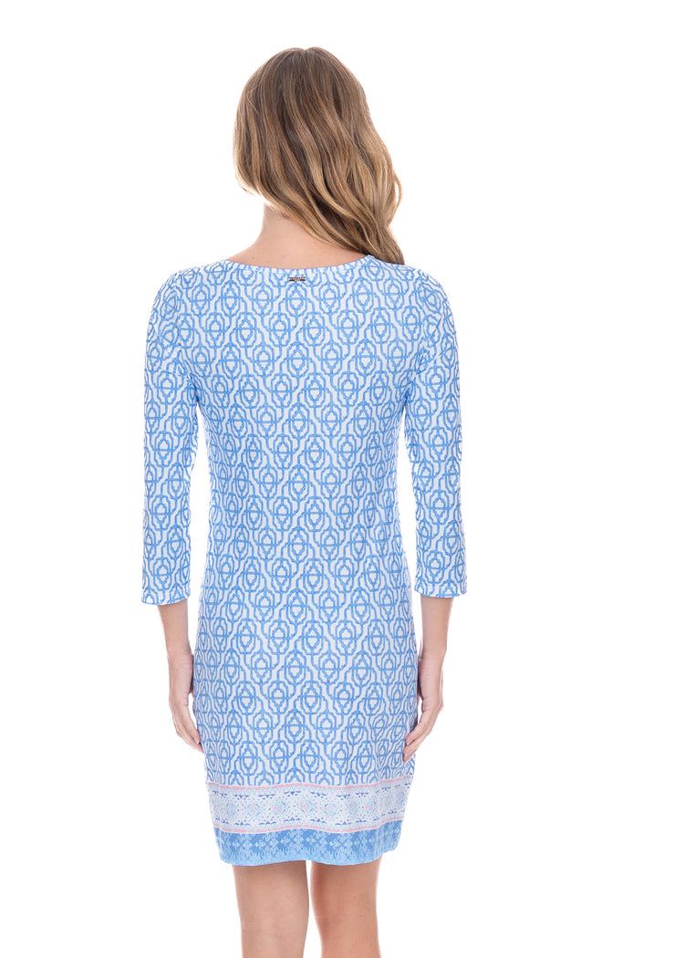 Back facing blonde model wearing the Lake Como Cabana Shift Dress while posing.