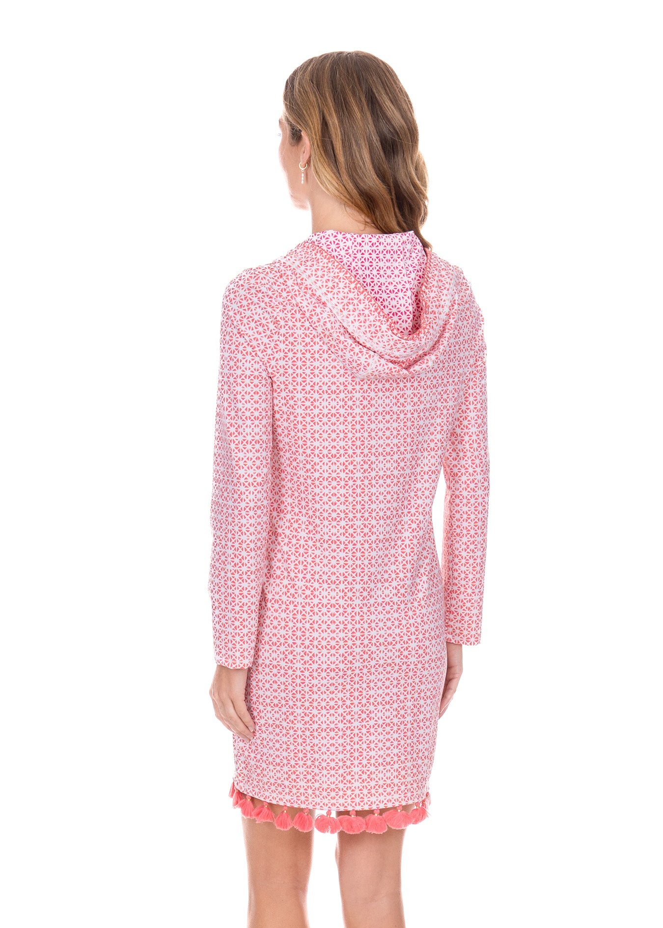Blonde woman wearing the Algarve Hooded Cover Up, showing the magenta print on the inside of the hood.