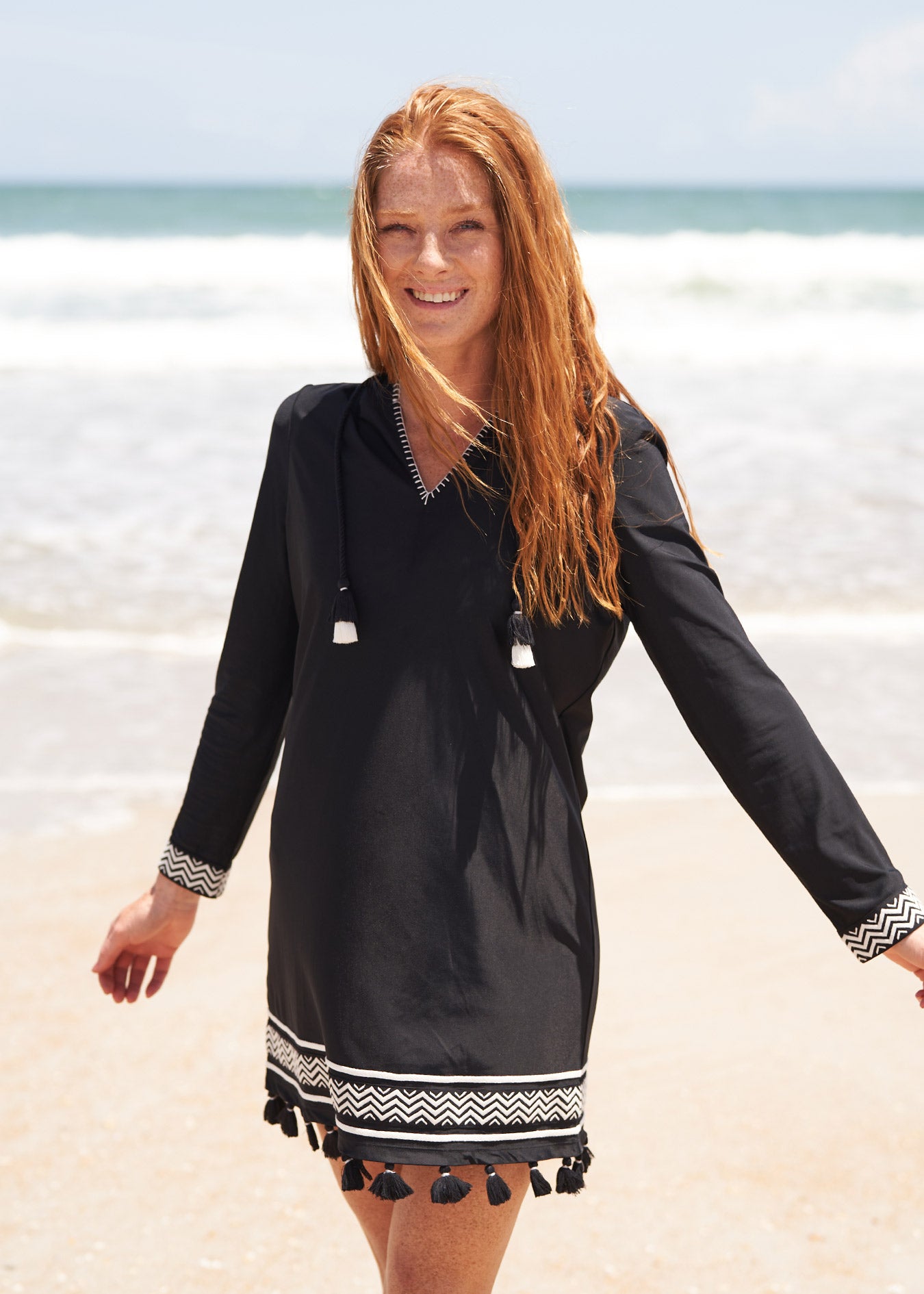 Woman on the beach wearing Sanibel Hooded Cover Up.