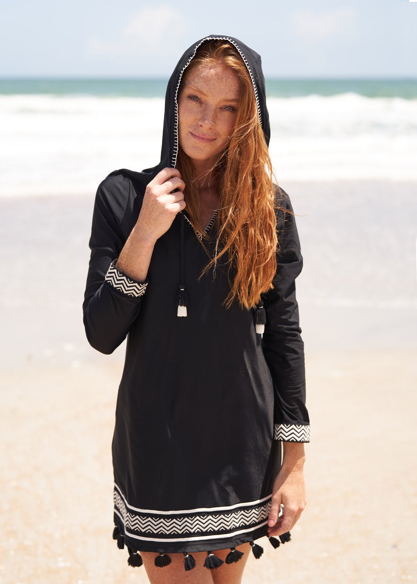 woman on the beach wearing Sanibel Hooded Cover Up.