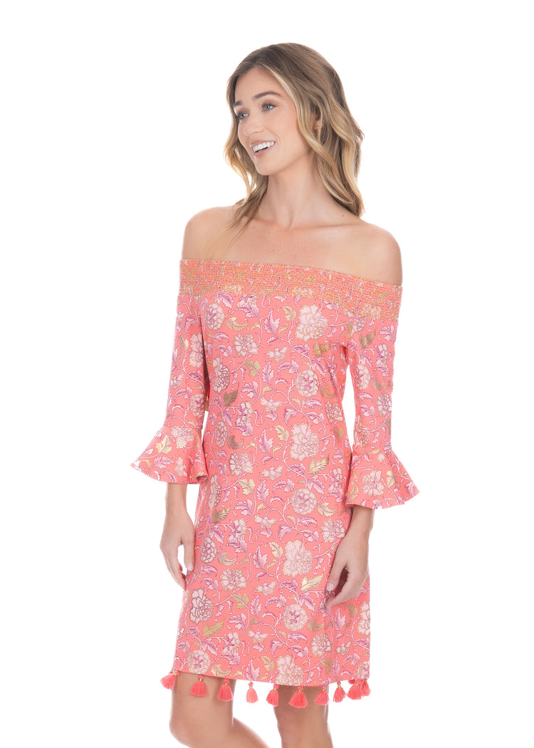 Side profile of blonde woman wearing the Coral Metallic Off the Shoulder Dress while smiling. 