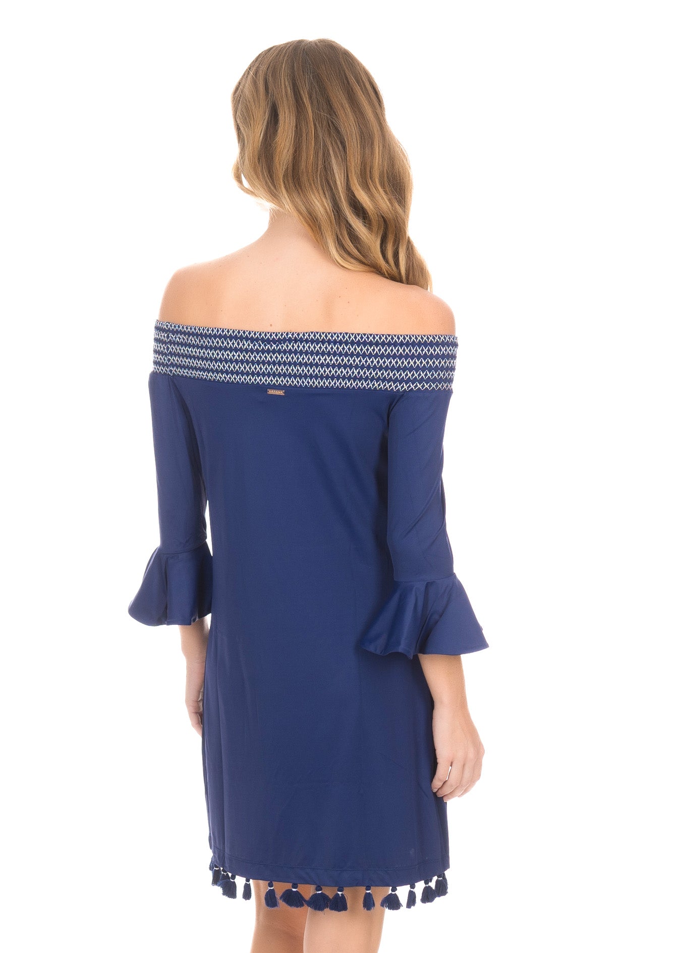 Back facing blonde woman wearing the Navy Embroidered Off The Shoulder Dress.