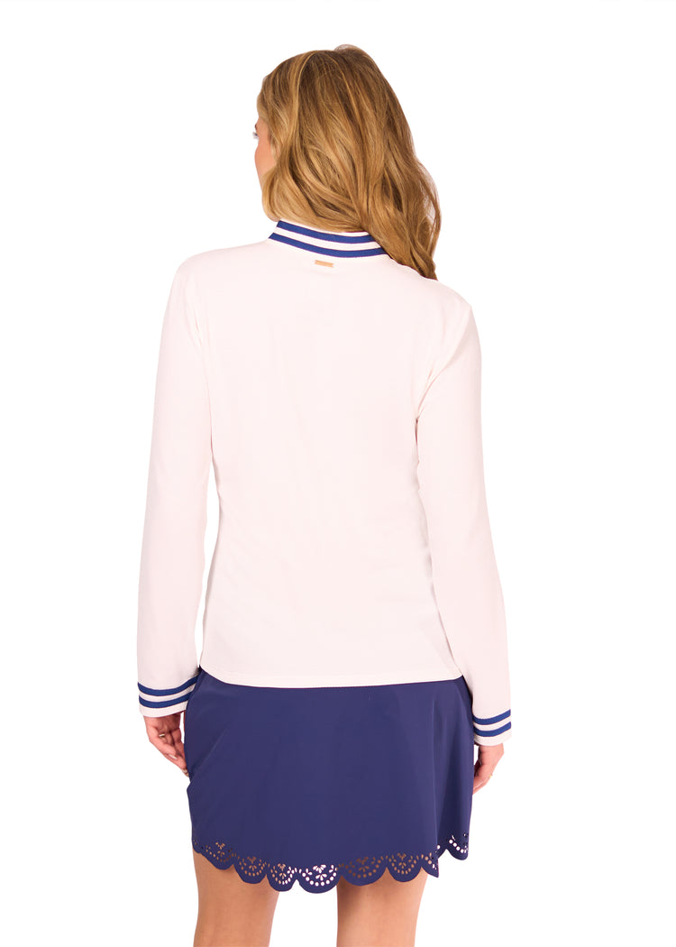 Back of Woman in White Collared 1/4 Zip and Navy Scallop Skort