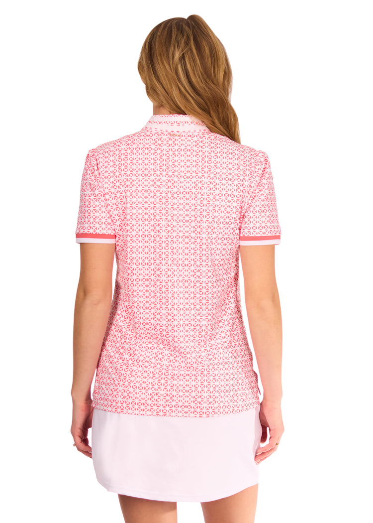 Back of woman in Algarve Short Sleeve Collared Quarter Zip and White Skort