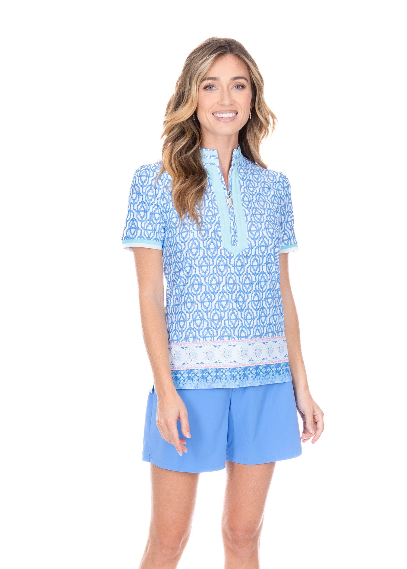 Blonde model wearing the Lake Como Short Sleeve Collared Quarter Zip with blue shorts.