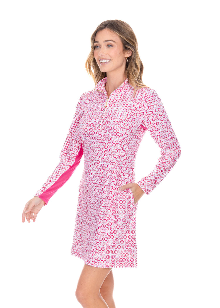 Blonde model wear Algarve 1/4 Zip Sport Dress with white background showing the magenta underarm mesh.