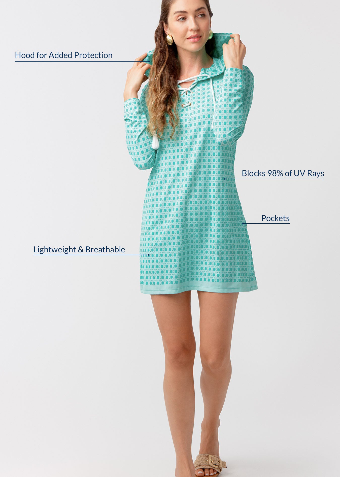 Woman wearing a green basketweave coverup with text highlighting features on a white background