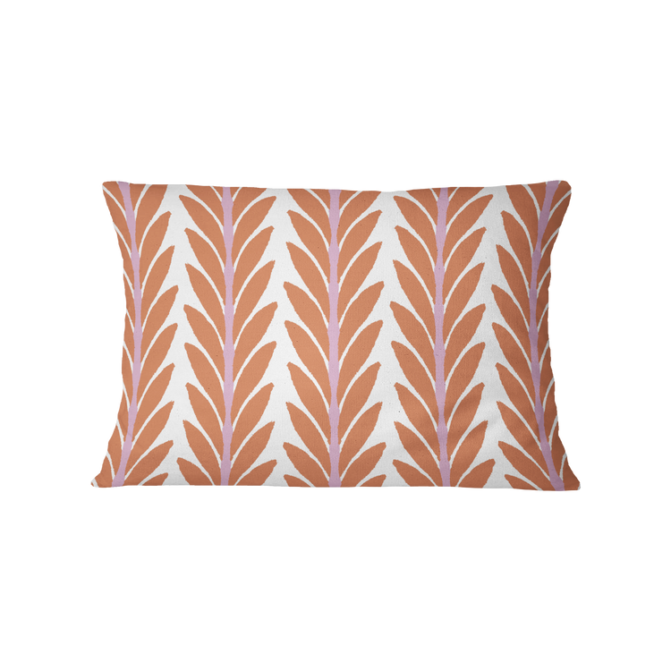 Decorative pillow with a leaf pattern on a white background