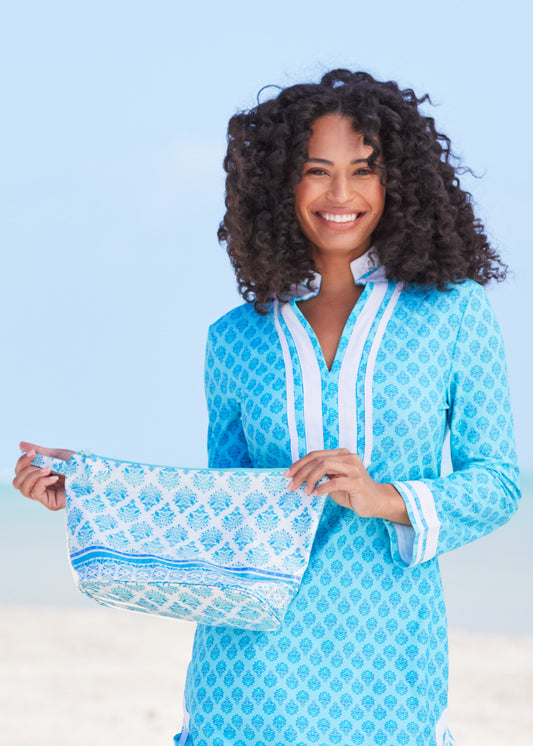 Woman smiling wearing Amalfi Coast Tunic Dress holding Amalfi Coast Large Accessory Bag