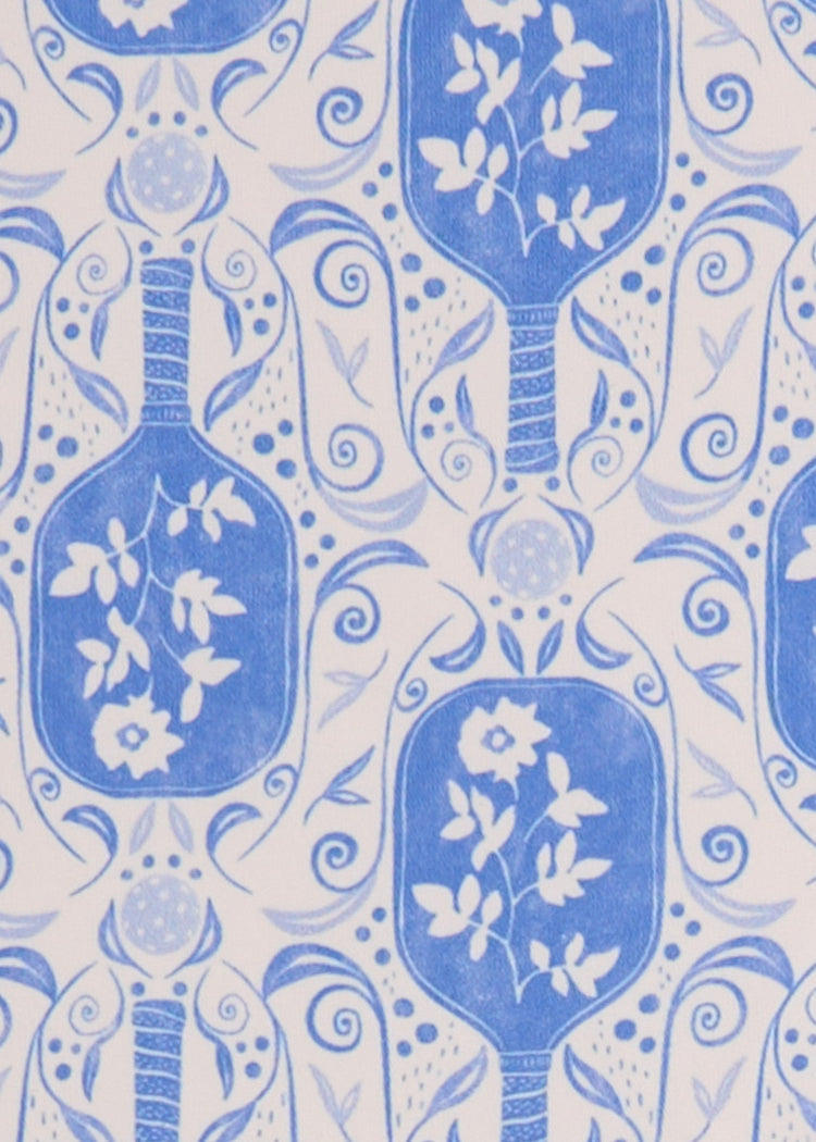 A close up of the UPF 50+ periwinkle pickleball printed fabric on the Cabana Life Tennis Long Sleeve Performance Top.