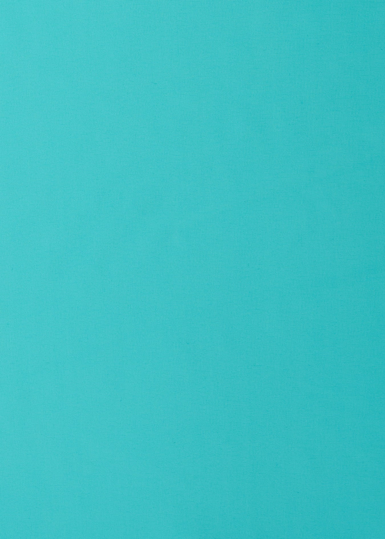 A close up of the UPF 50+ aqua fabric on the Cabana Life Aqua Embroidered Convertible Ruched Rashguard.