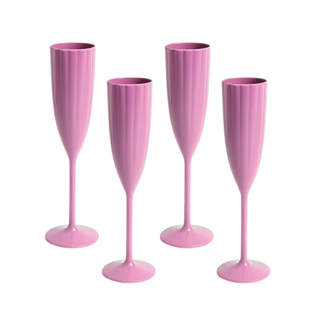 Four pink champagne flutes on a white background