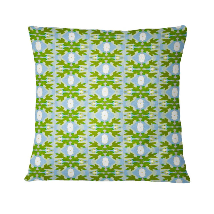 Decorative pillow with a green and blue pattern on a white background