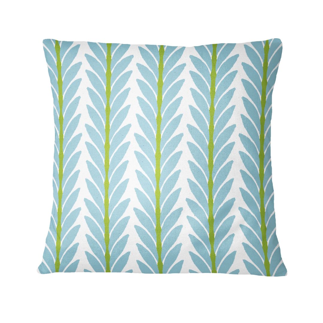 Decorative pillow with leaf pattern on a white background