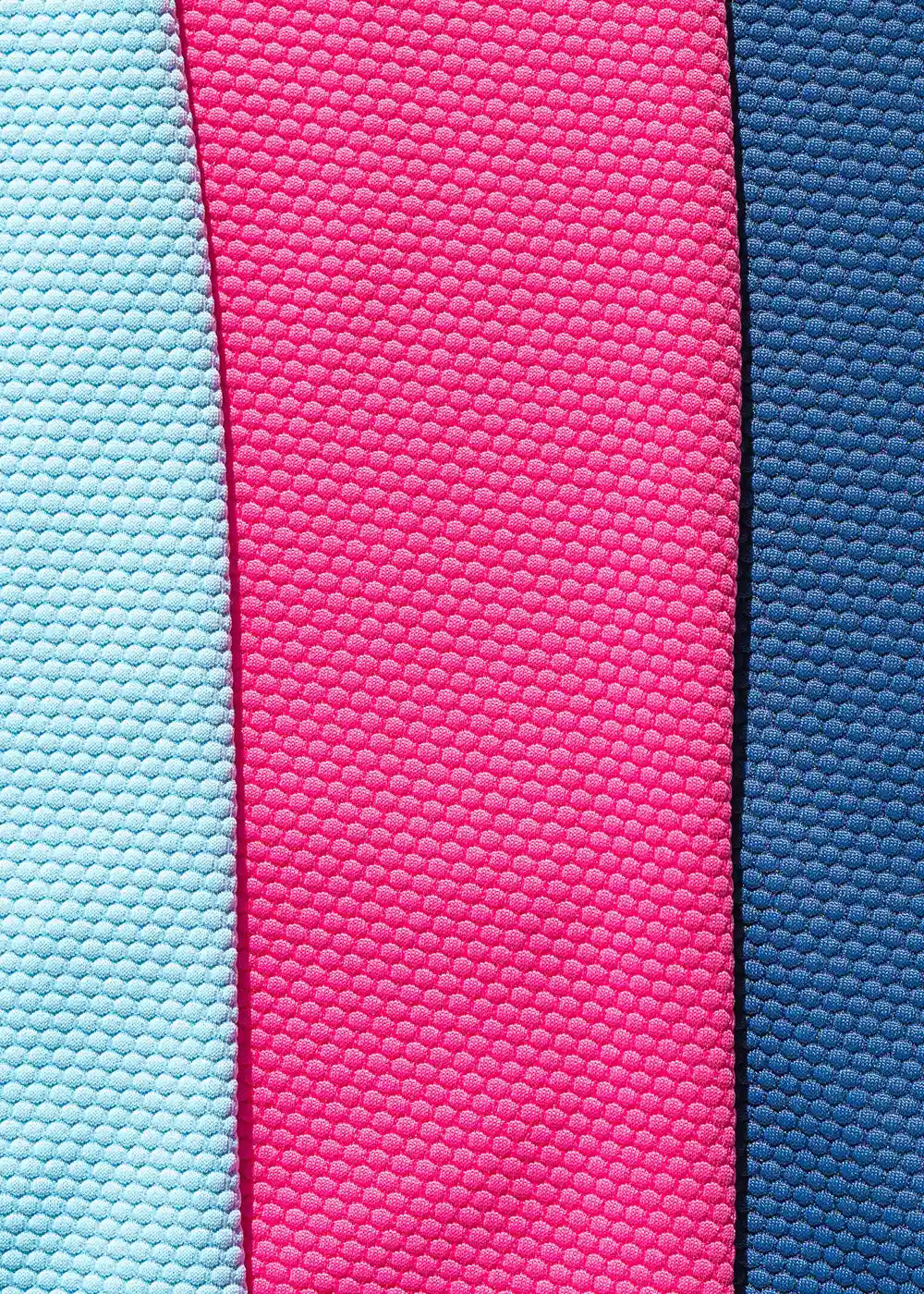 An image showing the Cabana Life dress fabric in pink, aqua and navy.