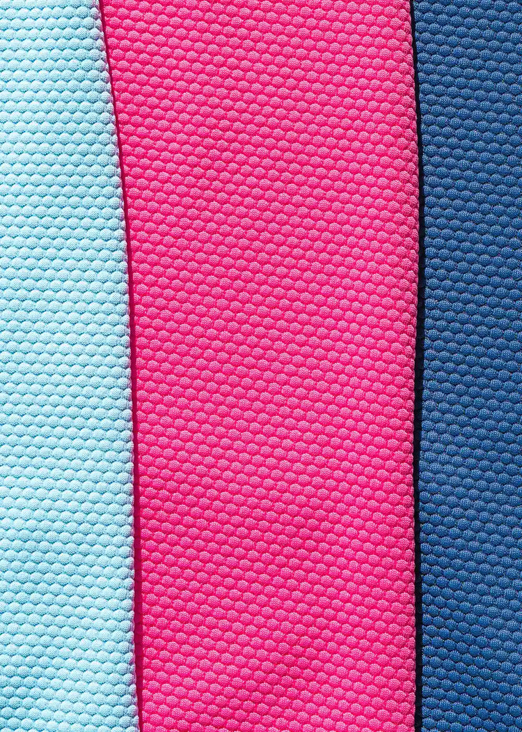 An image showing the Cabana Life dress fabric in pink, aqua and navy.