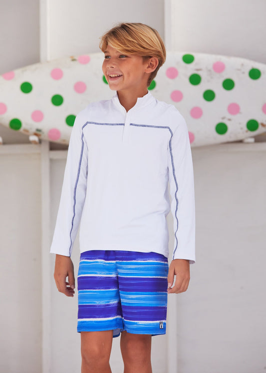 Boy wearing the blue Cabana Life sun protective San Sebastian Stripe Boys Swim Trunk.