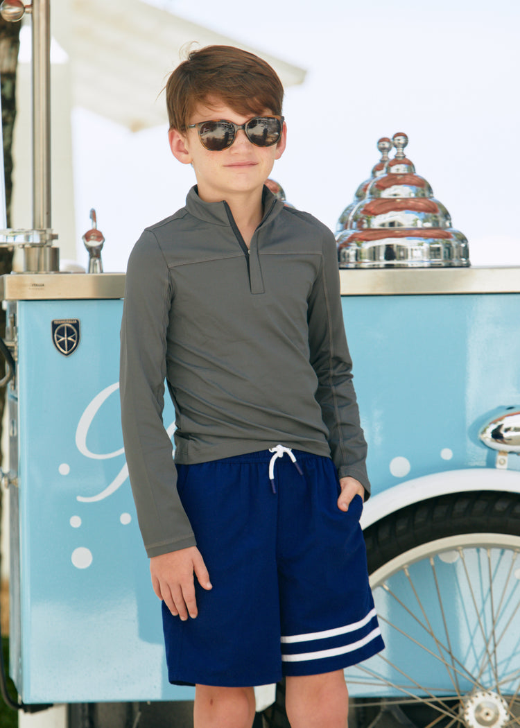 Boy wearing Boys Grey Sport Zip Top & Boys Navy Swim Trunks