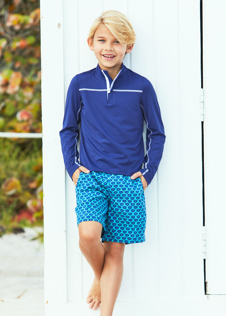 Boy wearing Boys Navy Sport Zip Top and Boys Aruba Blues Swim Trunks