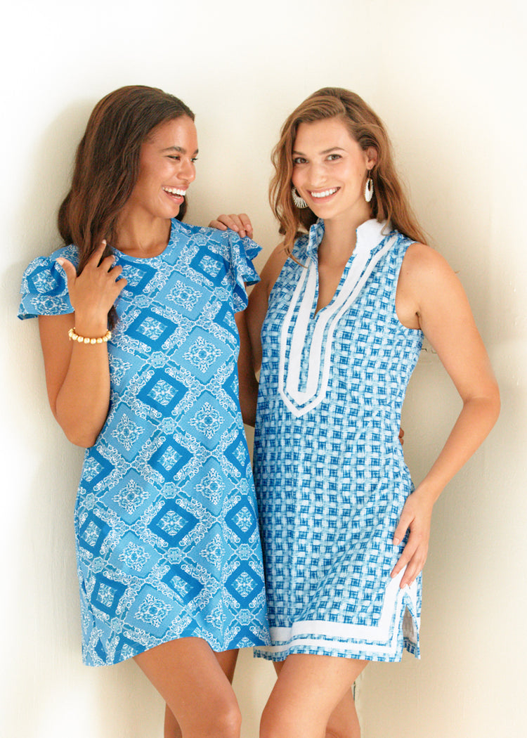 Woman wearing Windermere Sleeveless Tunic Dress with woman wearing Windermere Ruffle Short Sleeve Dress.