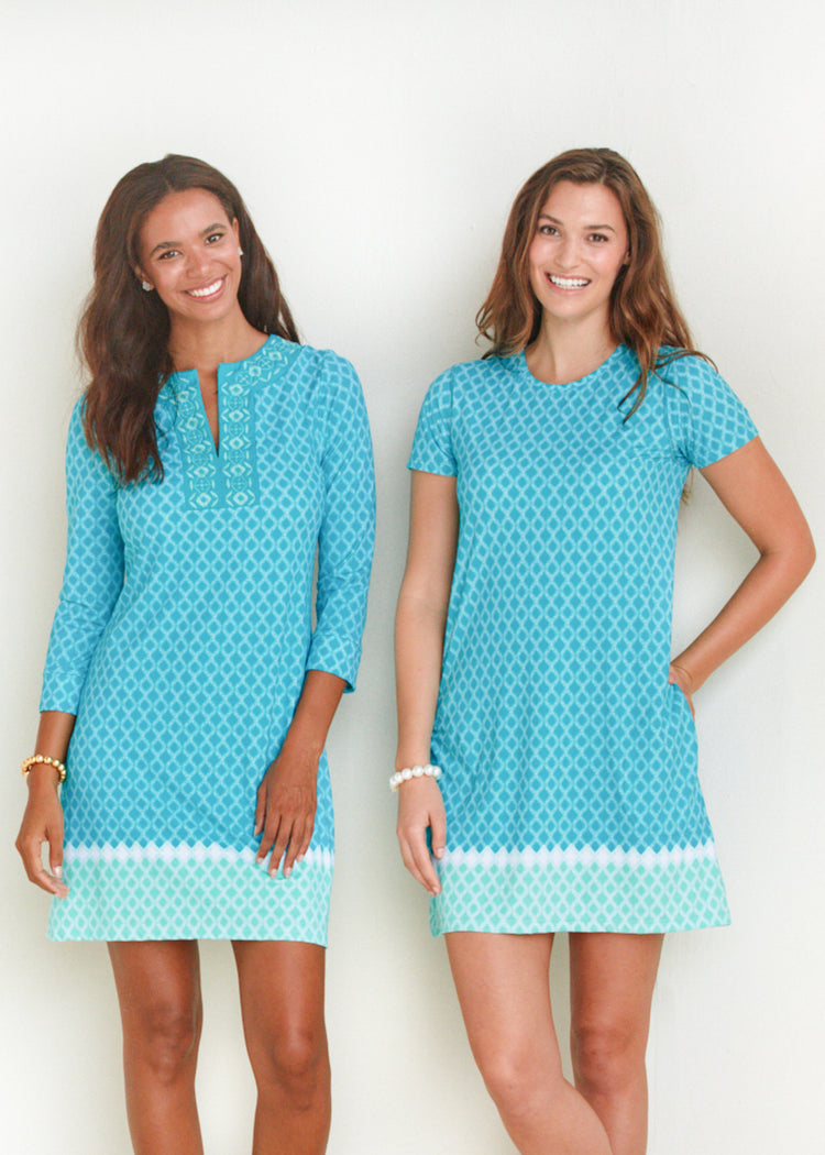 Woman wearing St. Pete Short Sleeve Shift Dress standing with woman wearing St. Pete Embroidered Tunic Dress.