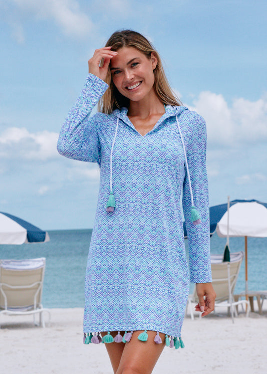 Woman on the beach wearing Naples hooded cover up.