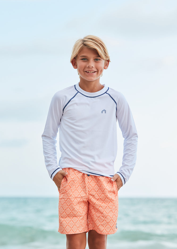 Boy wearing Fisher Island Swim Trunks.