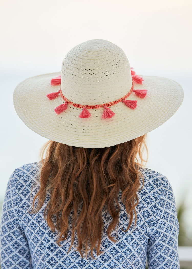 Woman wearing White Wide Brim Sun Hat.