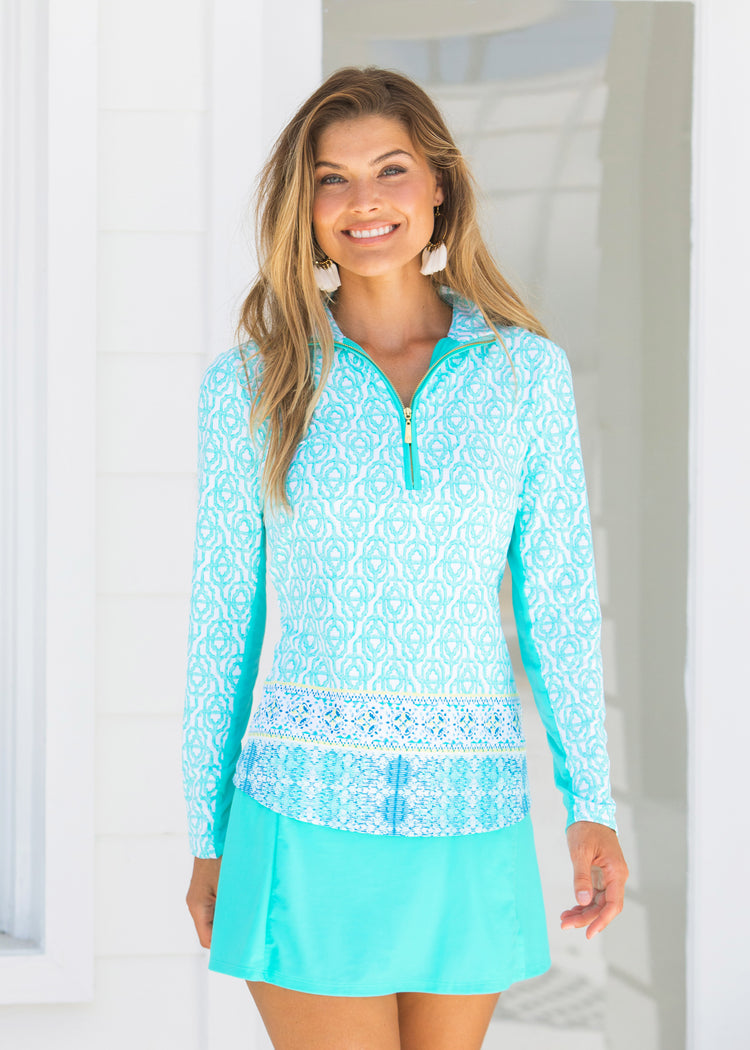 Woman wearing Coastal Cottage UPF 50+ Wicking Performance Zip Top and Turquoise Longer Swim Skirt
