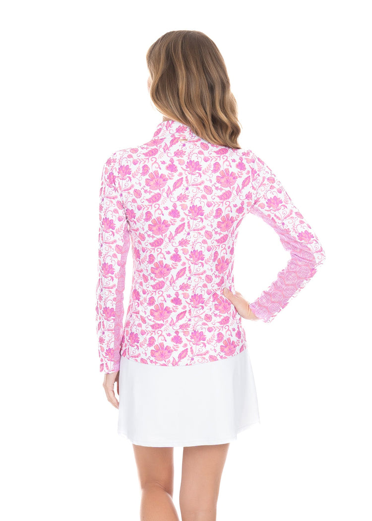 The back view of a woman wearing breathable and sun protective Cabana Life Provence 1/4 Zip Sport Top. 
