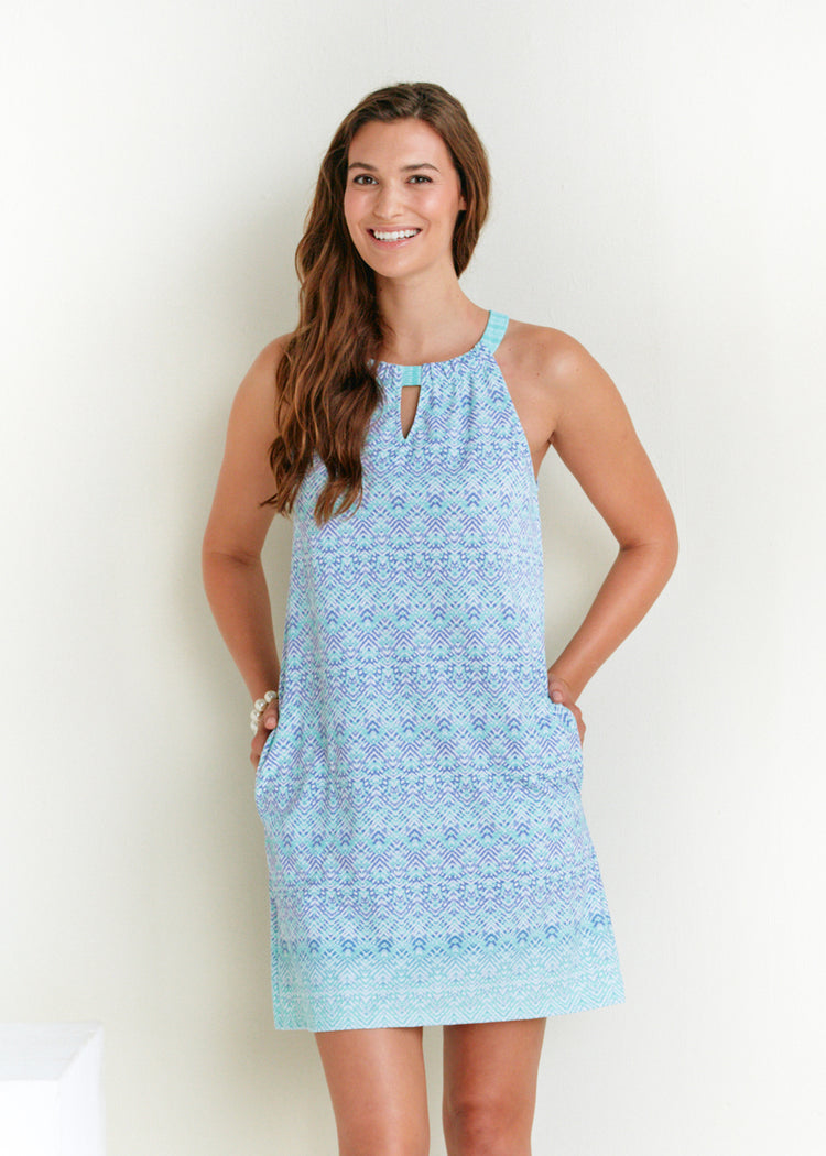 Woman wearing Naples sleeveless shift dress.