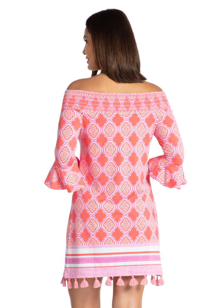 Woman modeling back of Coral Geo Off The Shoulder Dress.