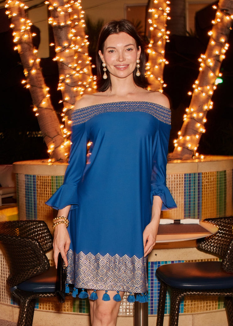 Woman wearing the Cabana Life Navy Metallic Off The Shoulder Dress out to dinner.