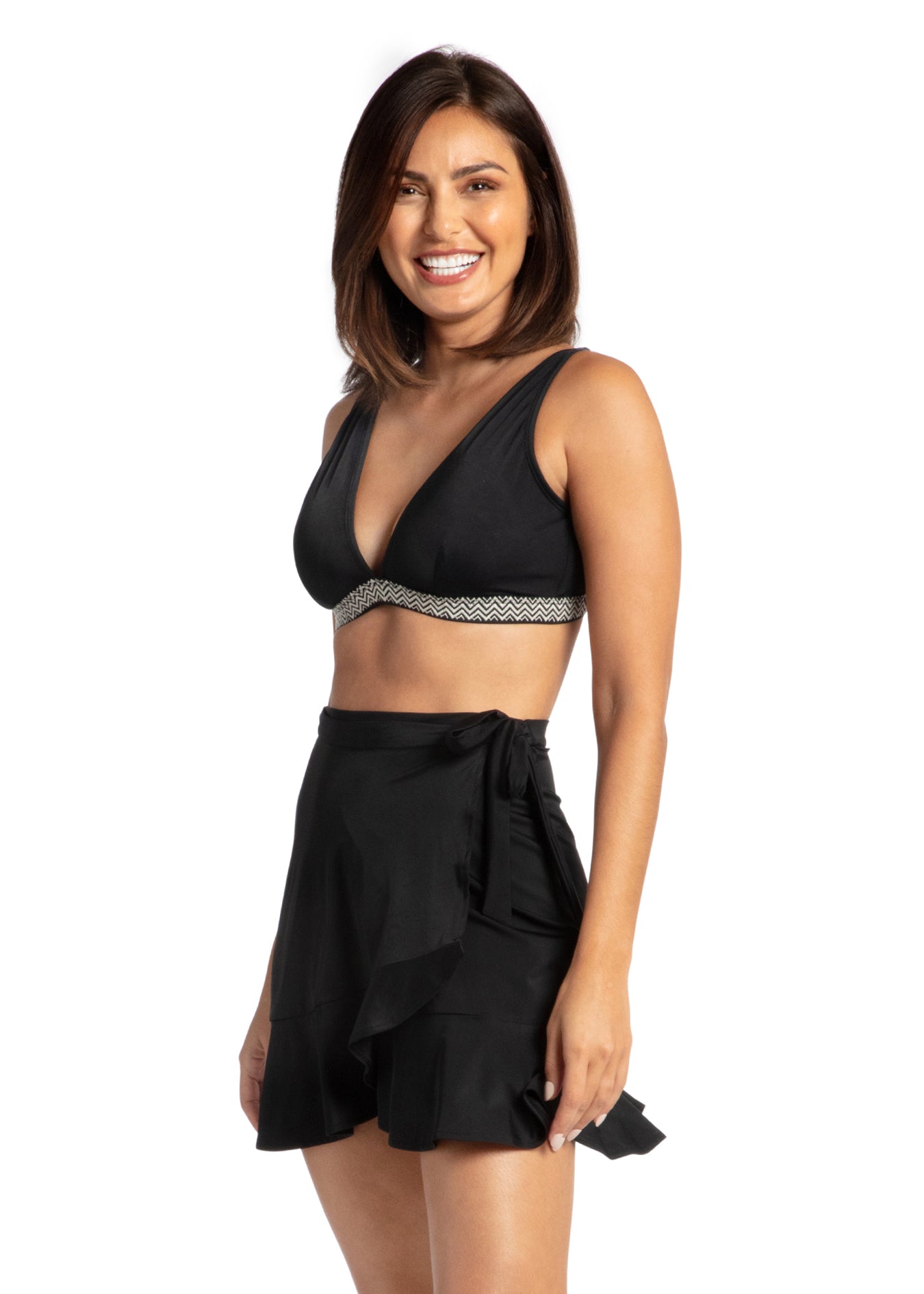 Woman wearing Sanibel Reversible Bikini Top Black Wrap Skirt