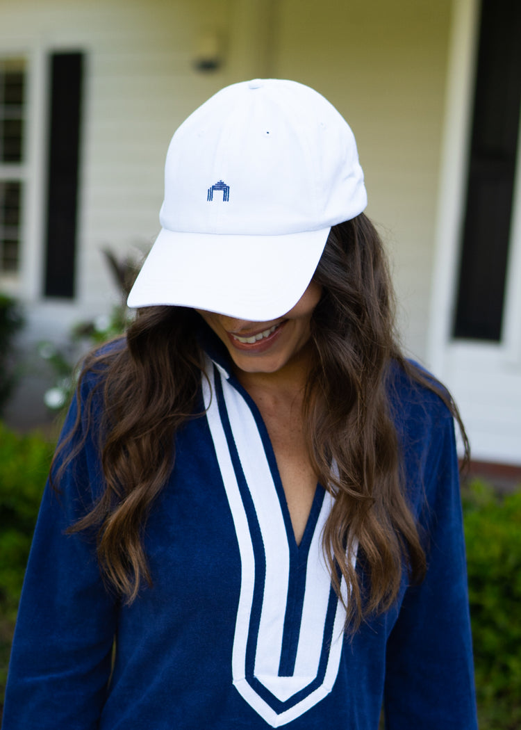 Woman wearing White Cabana Life Baseball Hat and Navy/White Terry Tunic