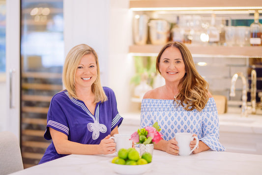 Left to right: Angie Hummell, Interior Designer at Nesting Place Interiors & Robyn, homeowner wearing Cabana Life Navy Tee Dress and Seascape Off The Shoulder Dress