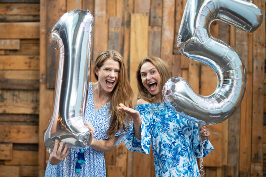 Cabana Life Founders with number 15 silver balloons wearing Palm Desert Midi Dress & Palm Desert Off The Shoulder Dress
