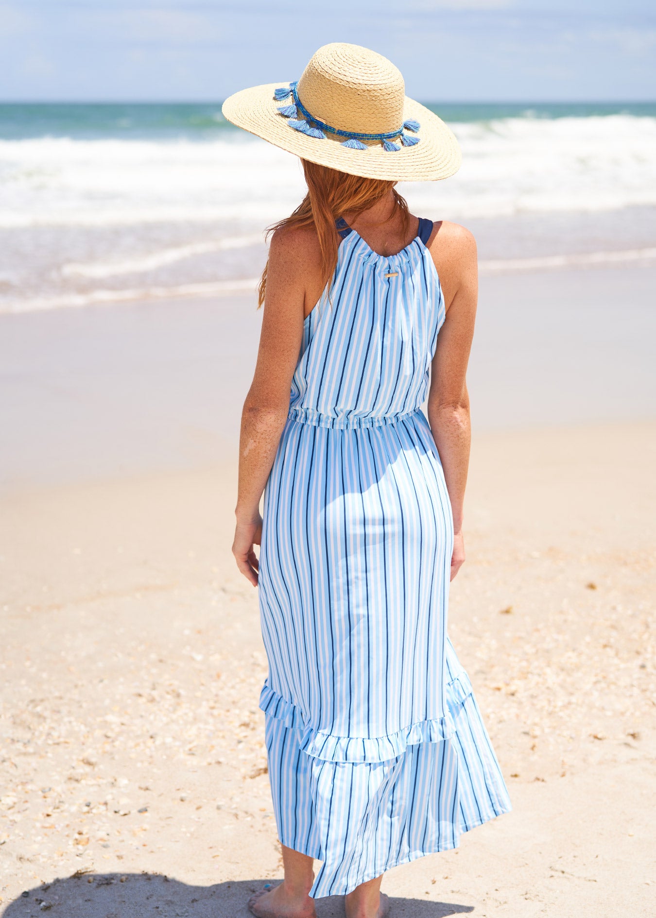 Woman wearing Blue Stripe Tie Waist Maxi Dress.