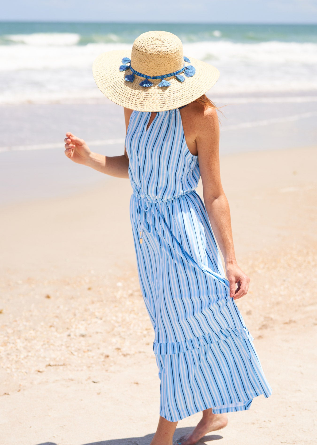 Woman wearing Blue Stripe Tie Waist Maxi Dress.